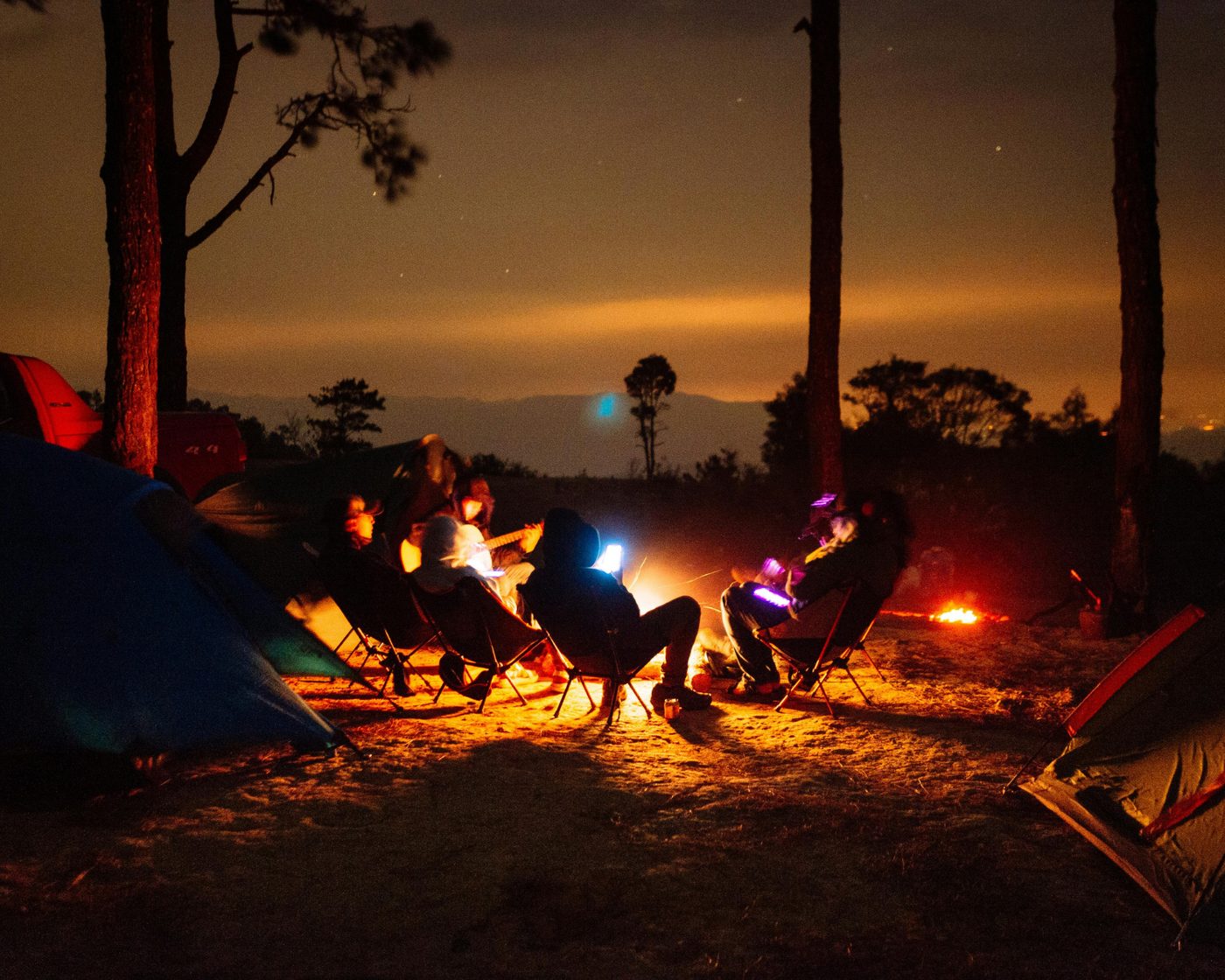 Group around campfire at night