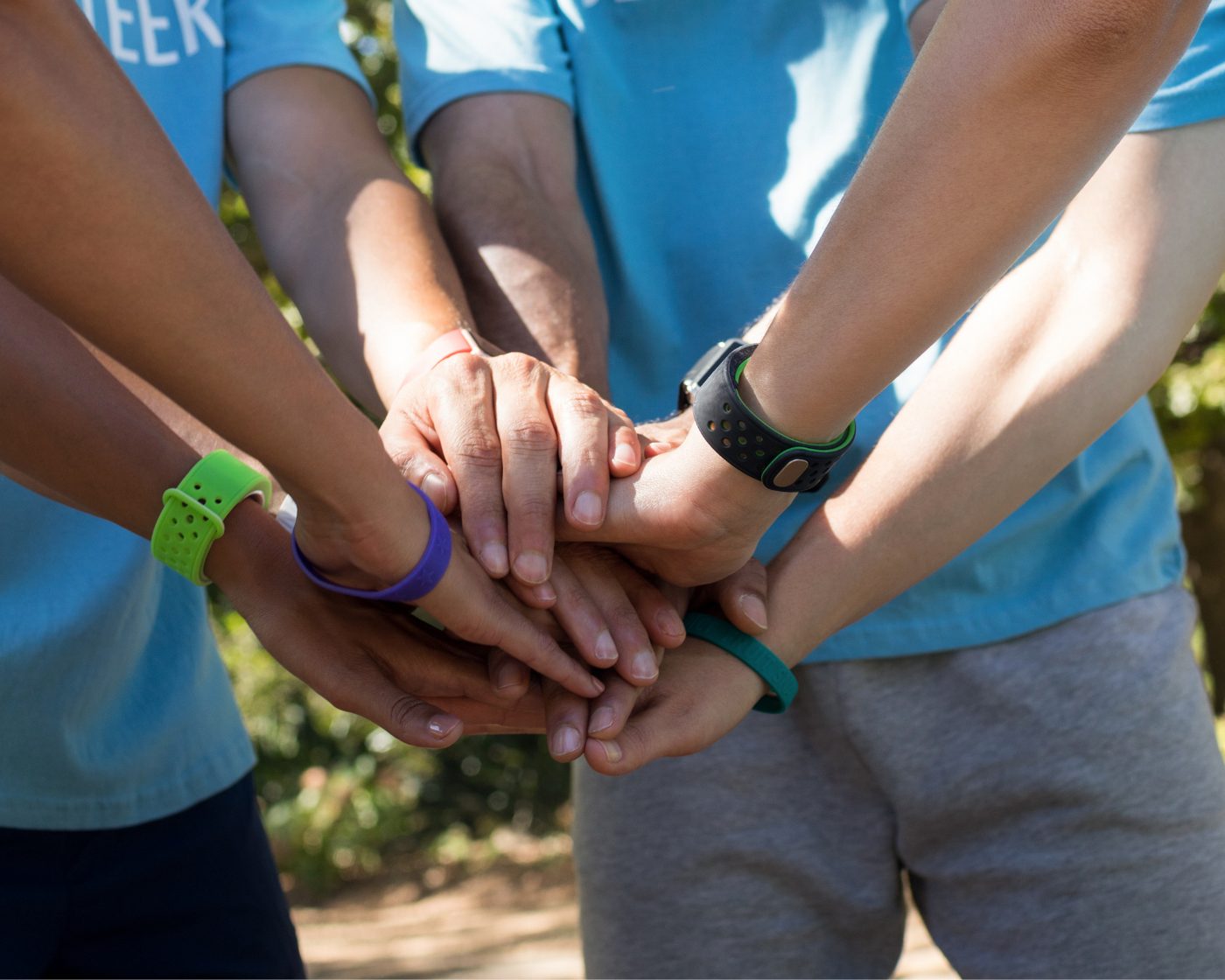 Volunteer hands stacked together
