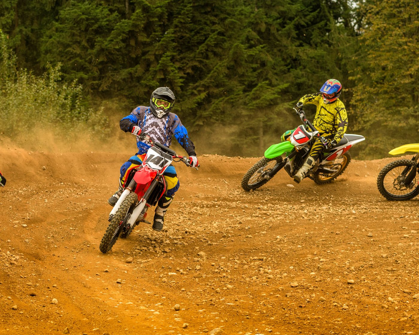 Riders on dirt track