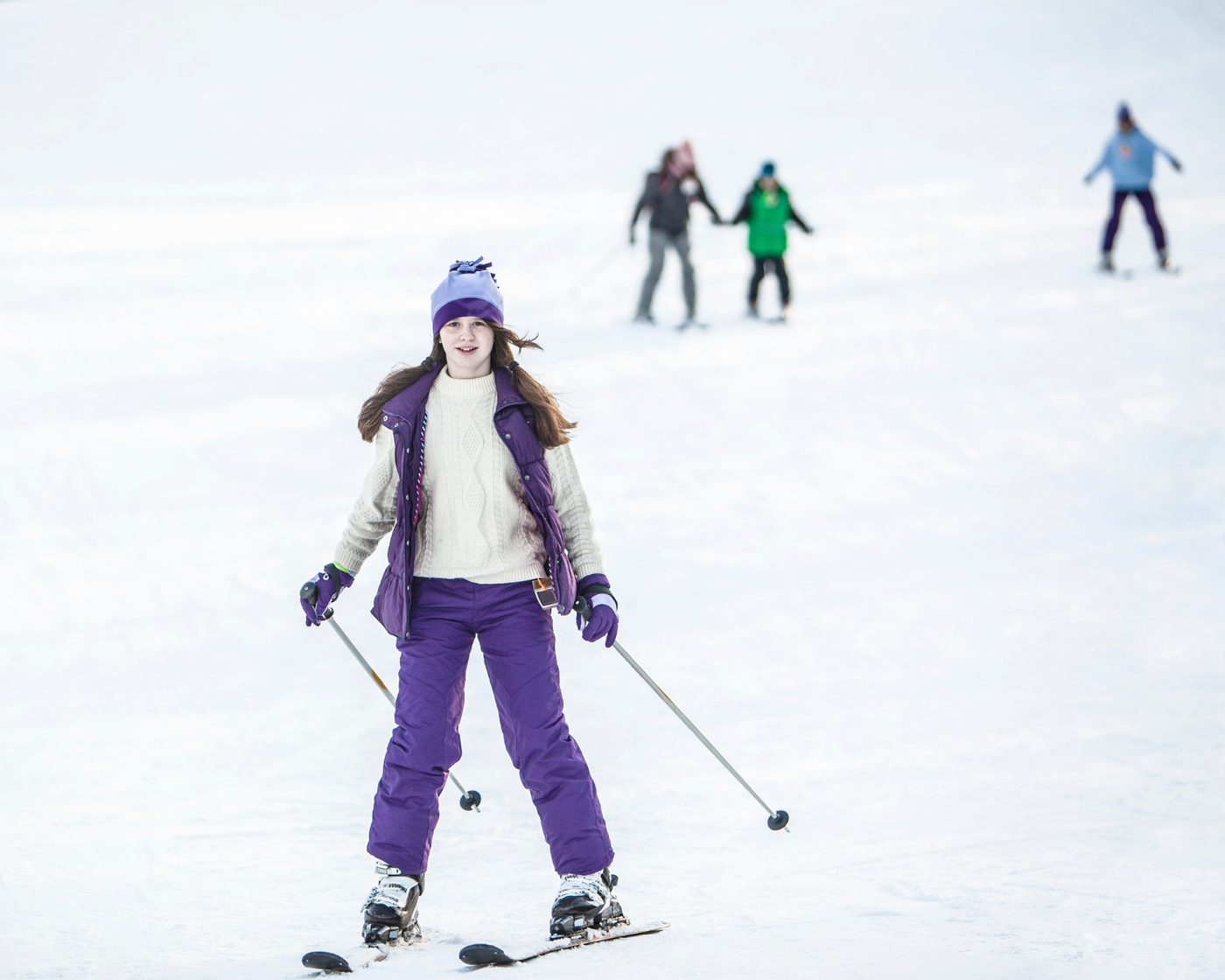 Smiling participant enjoying the ski weekend